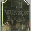 The brass plaque outside of Munro’s Book store – with a tree reflected on a sunny day.